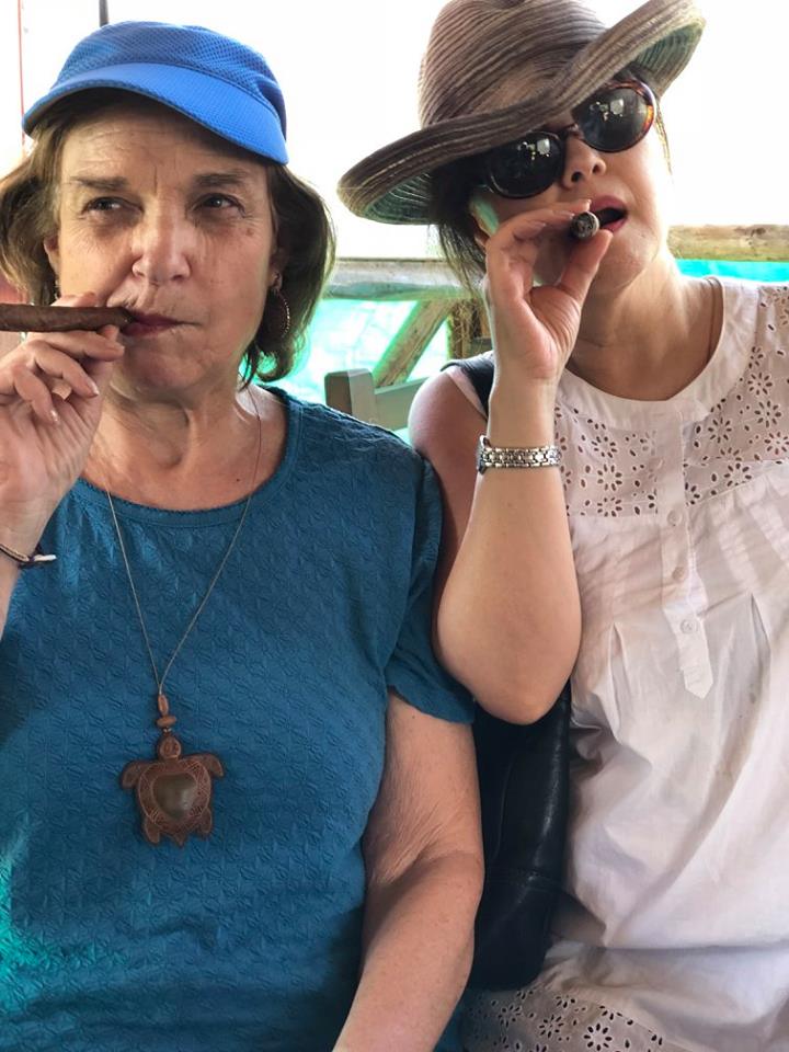 Joanna and Linda smoking cigars in Cuba